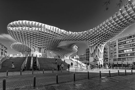 Grayscale Photo of People Walking on Metropol Parasol