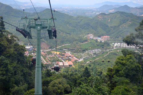 Free Stunning landscape view featuring lush mountains and cable car ride in a scenic outdoor setting. Stock Photo