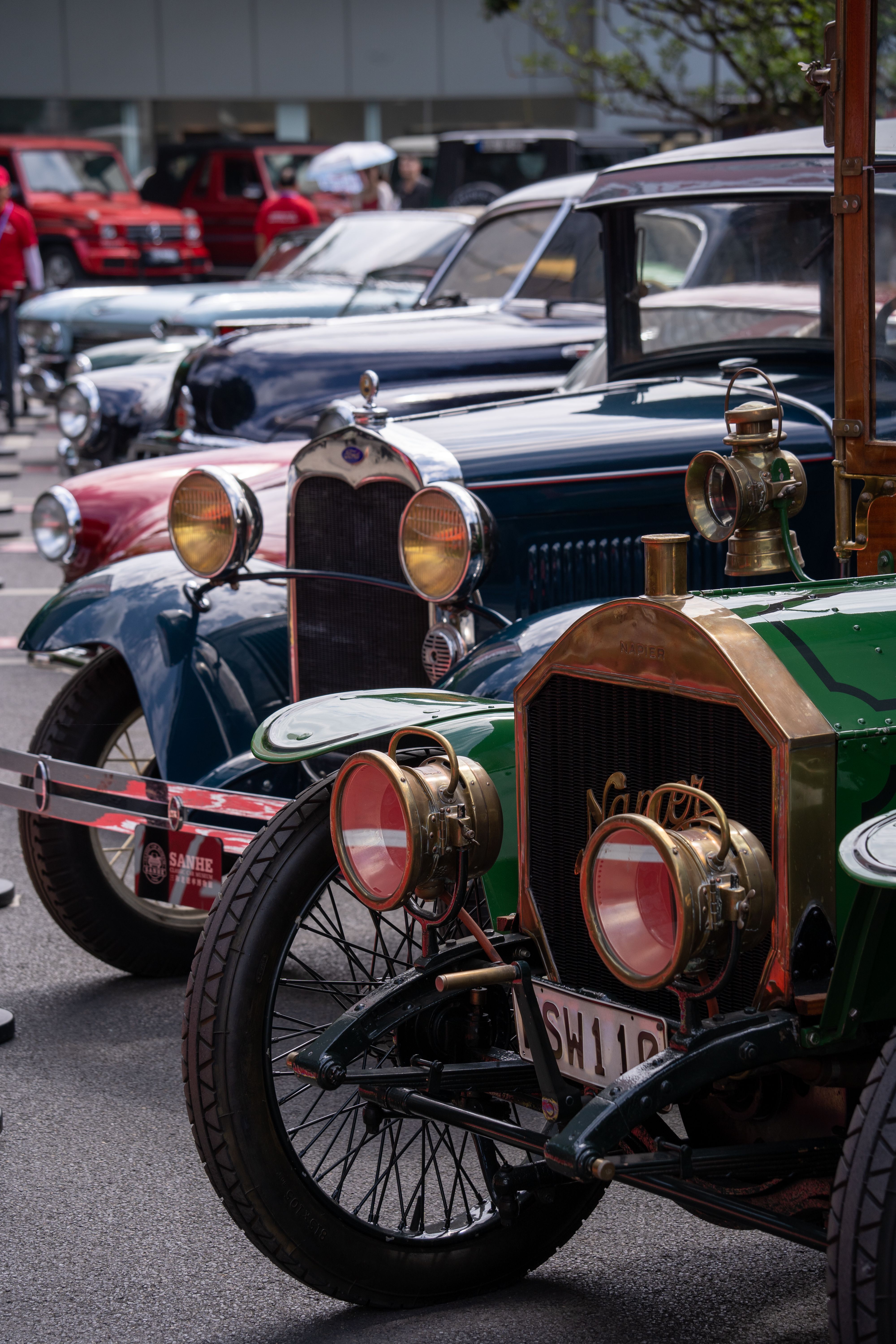 Row of classic vintage cars at an auto show