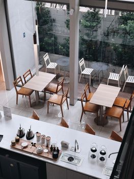 Explore this stylish Bangkok café featuring minimalist decor and ample seating for an inviting ambience.