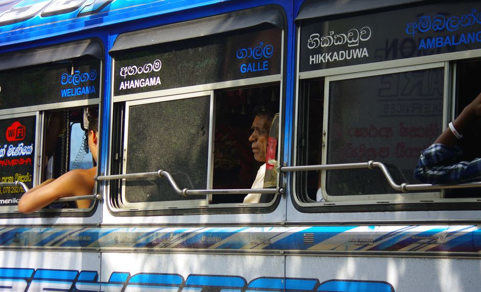 A local Sri Lankan bus with passengers on the Galle-Hikkaduwa route A local Sri Lankan bus with passengers on the Galle-Hikkaduwa route