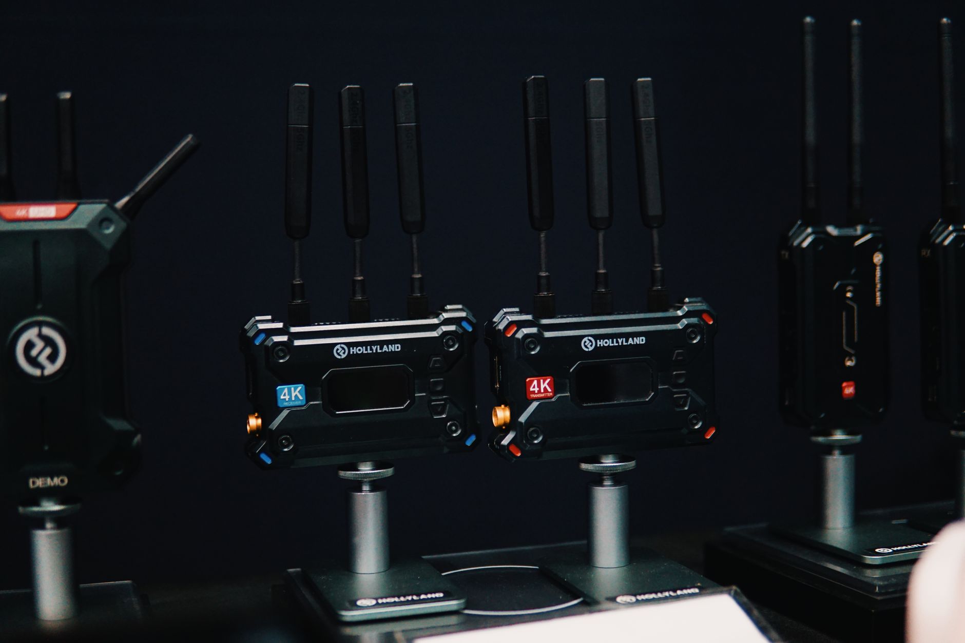 Close-up of wireless video transmitters on display, showcasing cutting-edge 4K tech.