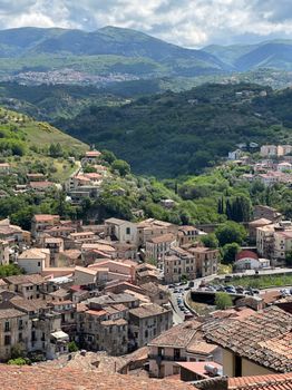 Breathtaking panoramic view of the medieval townscape in Cosenza, Italy under a summer sky.