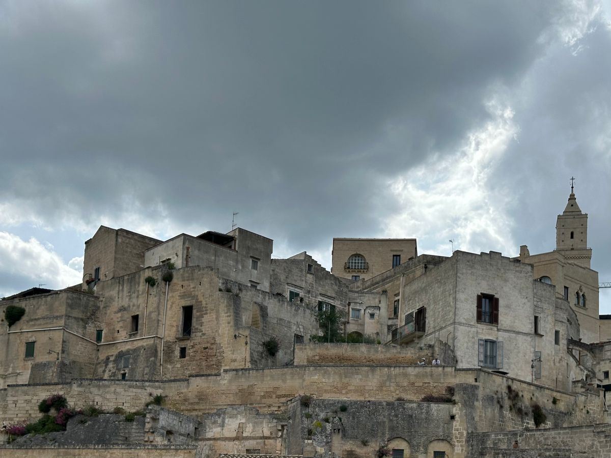 Matera's sassi — cave dwellings cascading down the Gravina gorge, inhabited for 9,000 years.