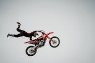 Man Performing Stunt on Motorcycle