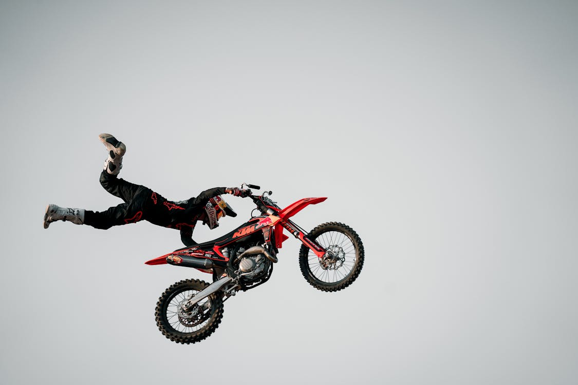 Free Man Performing Stunt on Motorcycle Stock Photo