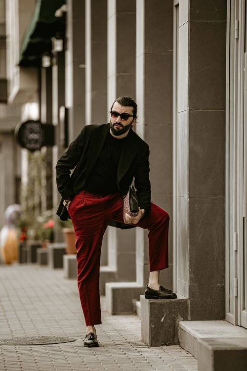 Free Fashionable man poses confidently on a city street in Baku, Azerbaijan. Stock Photo