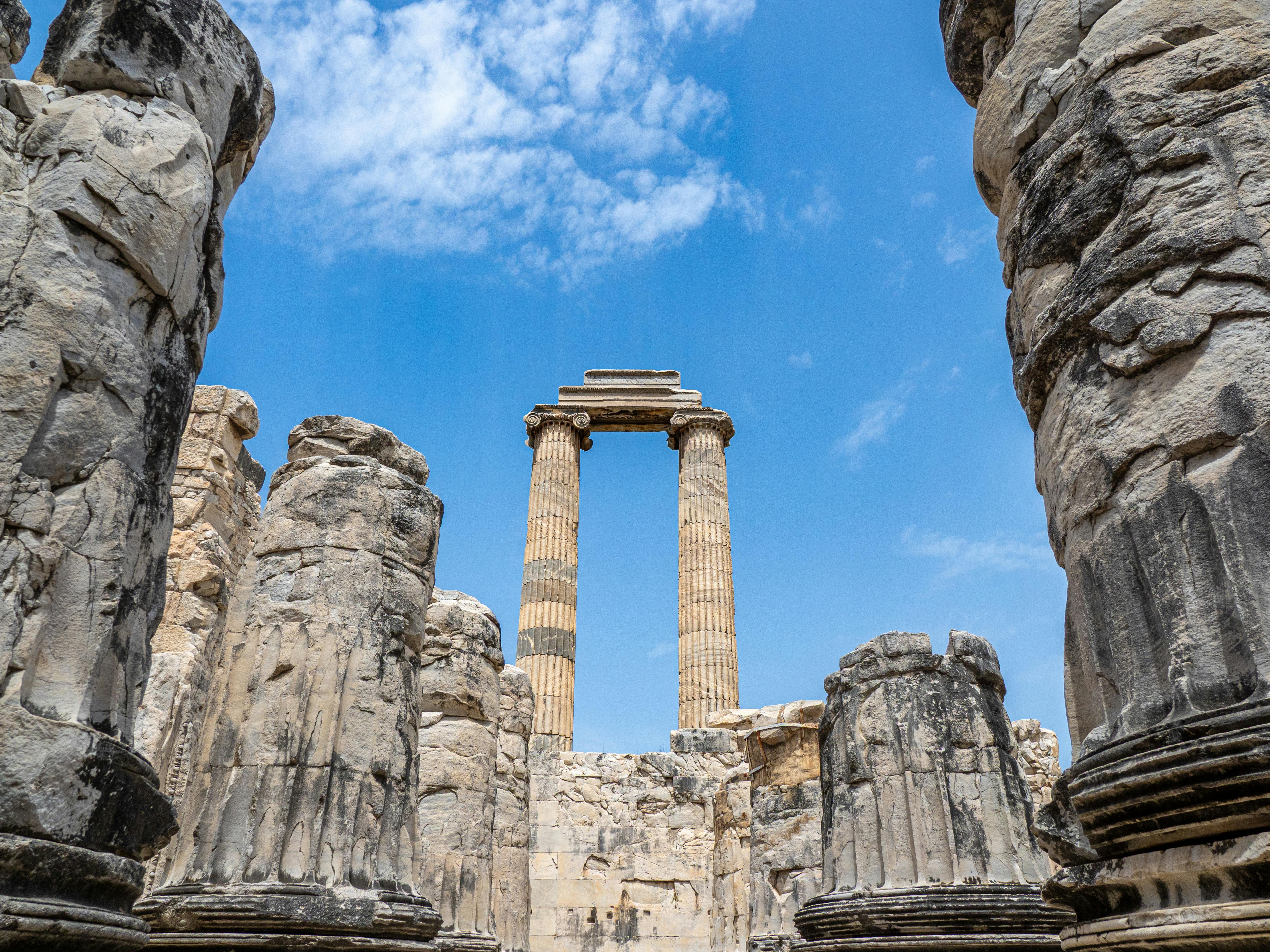 Explore the ancient ruins of the Temple of Apollo under a clear blue sky in Aydın, Türkiye.