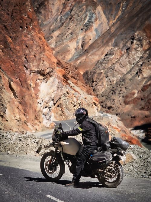 Free A motorcyclist navigates the rugged terrain of Ladakh, India, capturing adventure and scenic beauty. Stock Photo