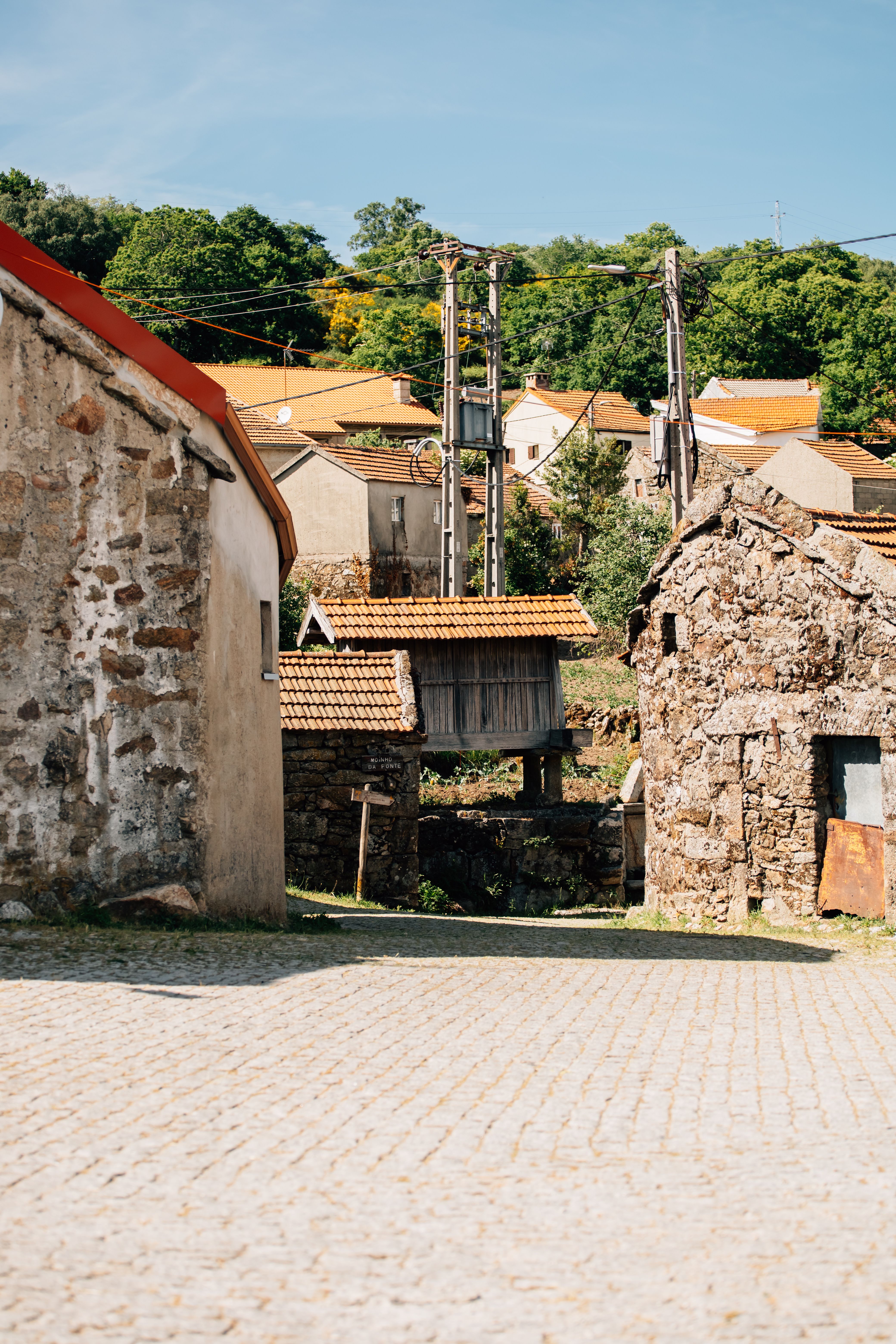 Rustic street view of a historical village in Montalegre, Portugal, showcasing traditional stone houses.