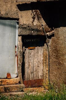 A rustic wooden door in Montalegre, Portugal, showcasing aged architecture with a natural, historical feel.