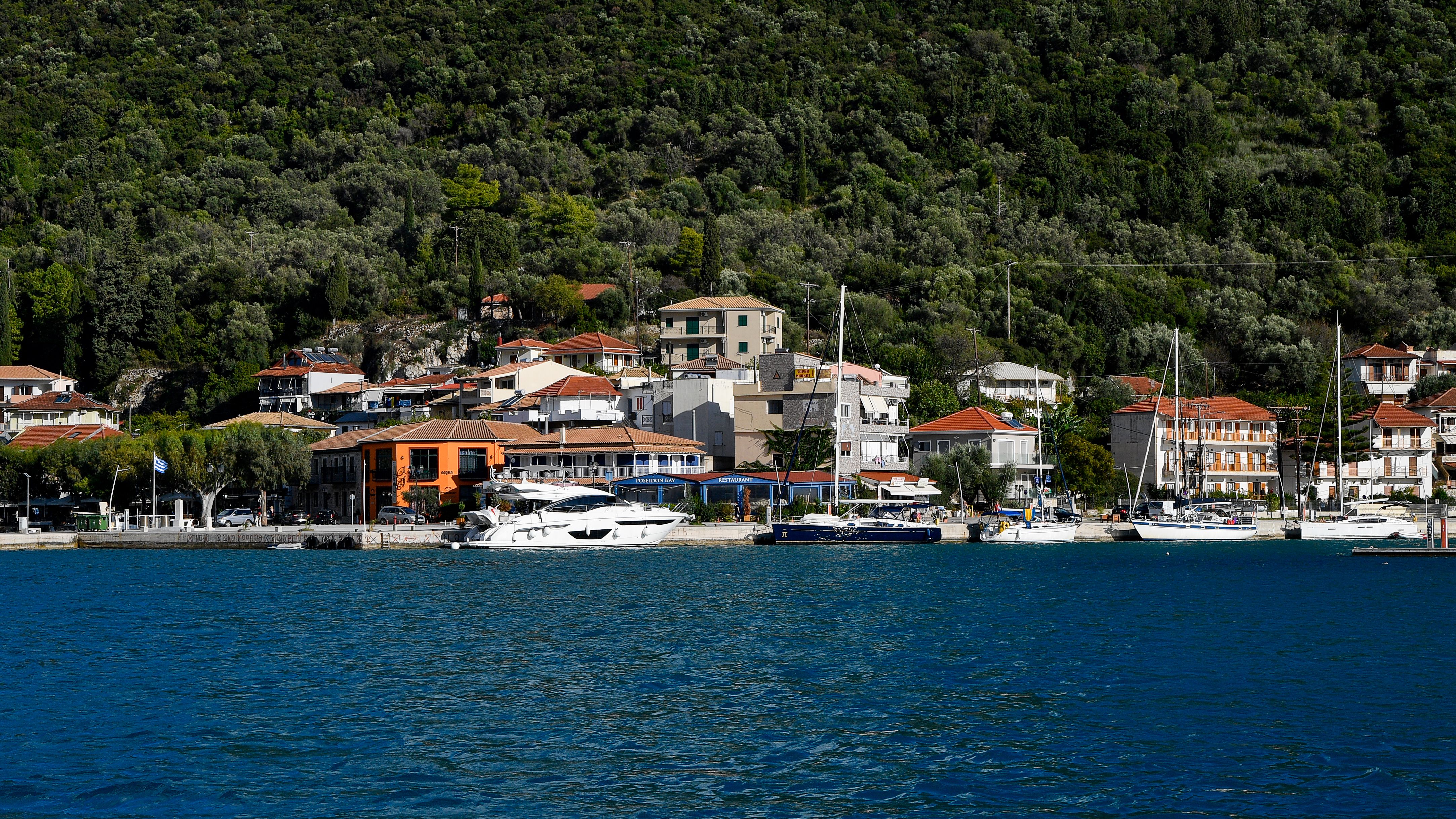 Outstanding Sailingboat: Kleftiko & Poliegos Full Day with Lunch & Open bar Review 2026 - Picturesque coastal village with yachts in Patra, Greece, exemplifying Mediterranean charm.