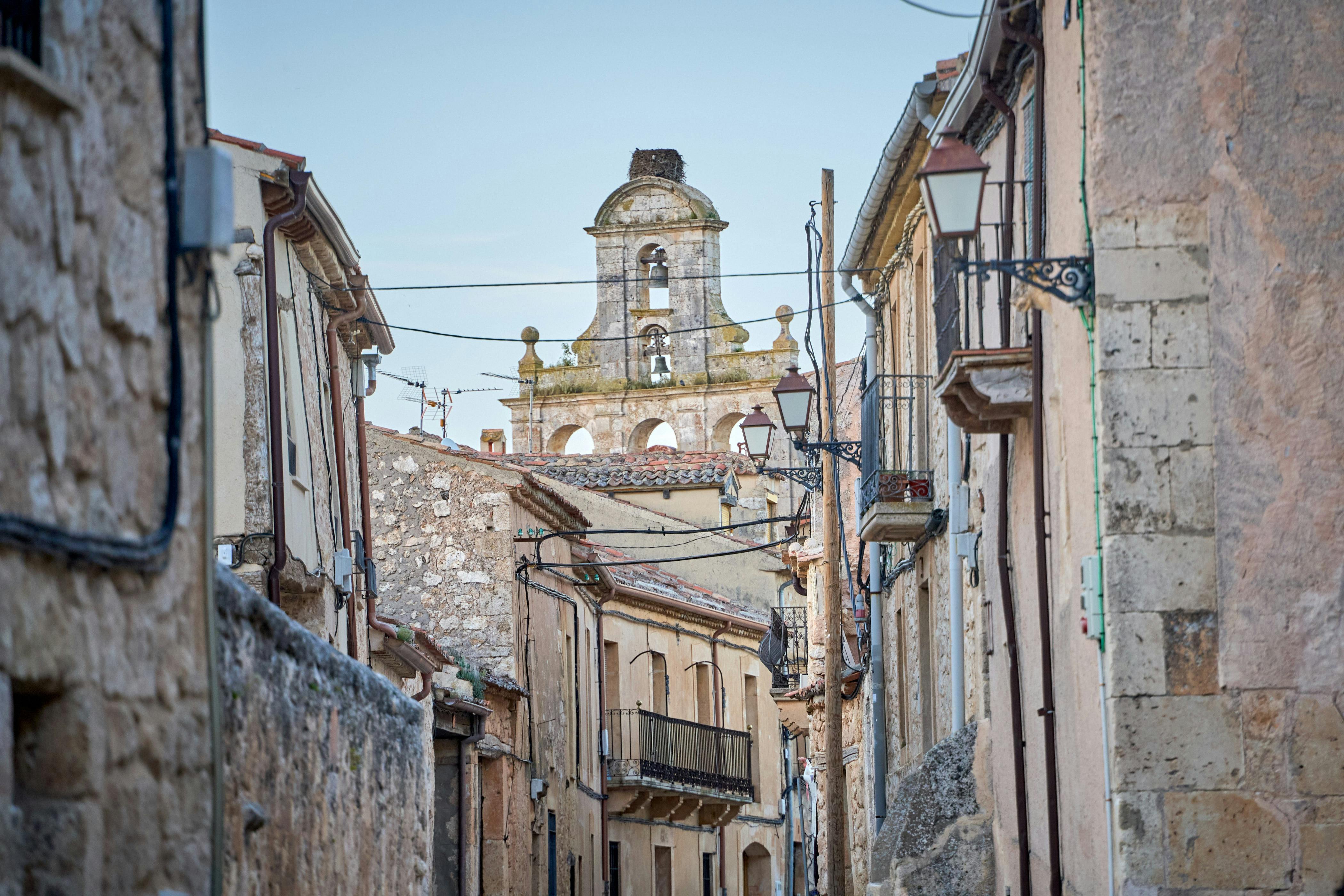 Picturesque street with historic architecture in Maderuelo, Castilla y León, Spain.