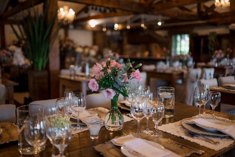 Flowers and glassware at a wedding reception