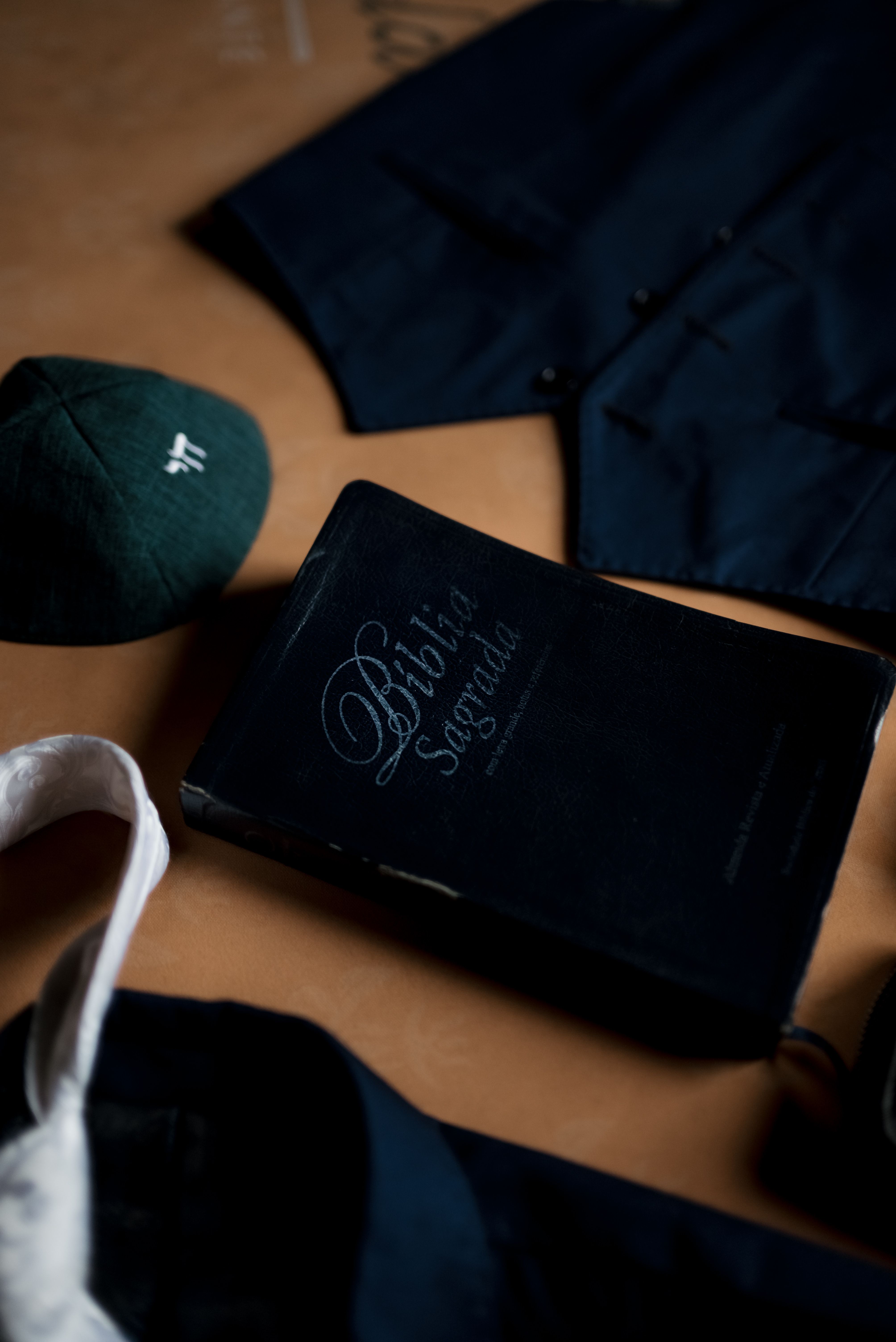 A flat lay of a religious book and cultural attire symbolizing spiritual tradition.