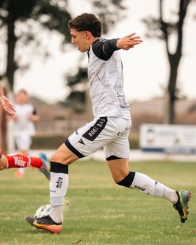 Dynamic shot of soccer players competing on an outdoor field. Perfect for sports themes.