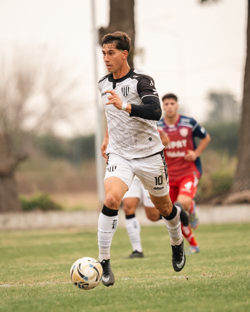 Free Dynamic shot of an athlete playing soccer outdoors, showcasing skill and speed. Stock Photo
