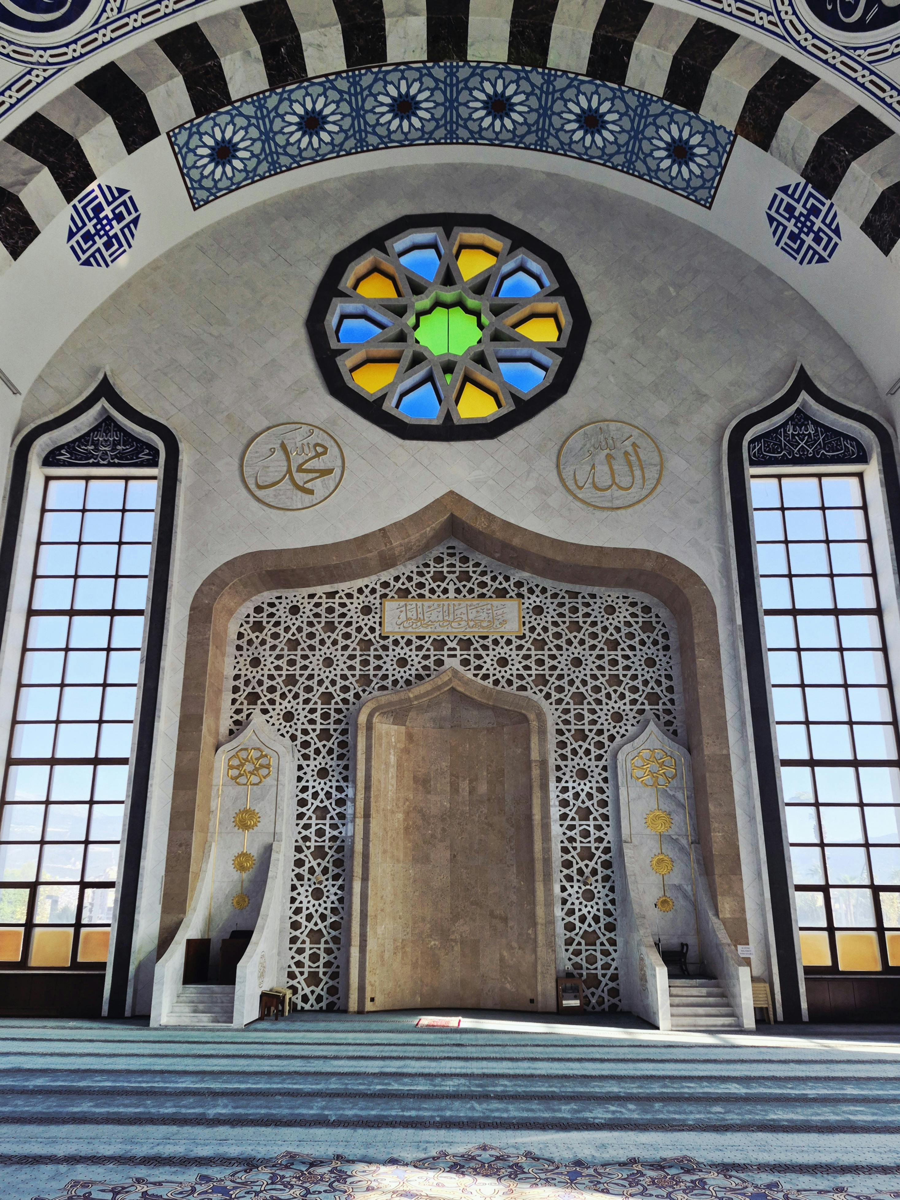 Intricate mosque interior featuring stained glass and geometric patterns. Spiritual and serene atmosphere.