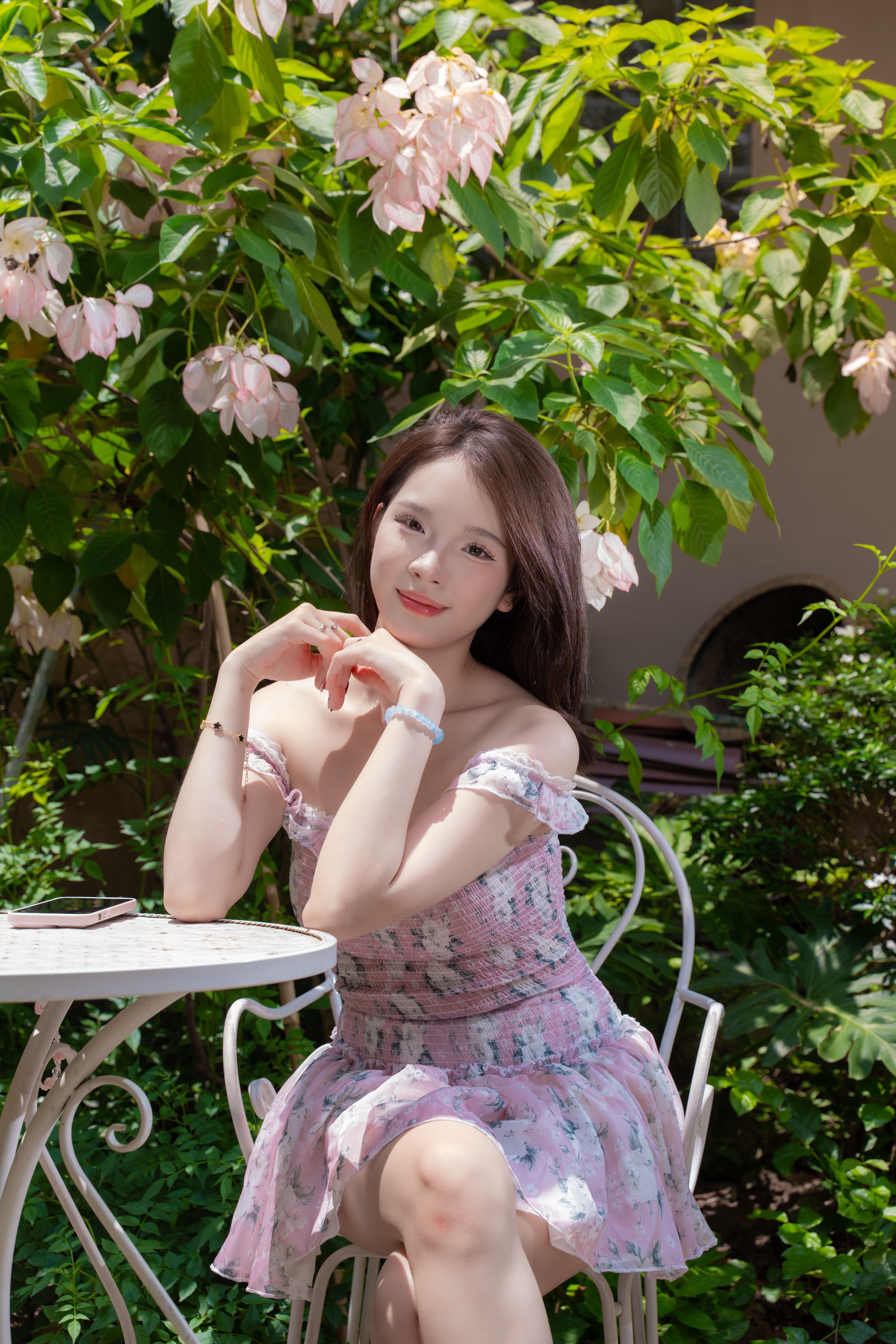 Young Woman Enjoying Sunny Day in Garden