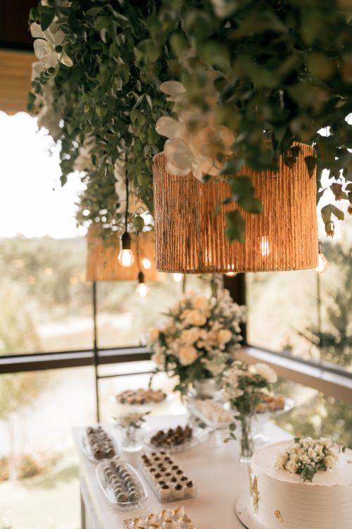 Free Beautifully set wedding reception table with floral decorations and elegant lighting. Stock Photo