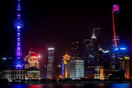 Free Explore the dazzling Shanghai skyline at night featuring the illuminated Oriental Pearl Tower and vibrant cityscape. Stock Photo