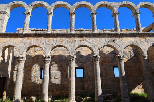 Free Stone arches of a historical building with clear blue sky background. Stock Photo
