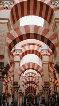 Stunning interior arches of the Mezquita Cathedral in Córdoba, showcasing Moorish architecture.