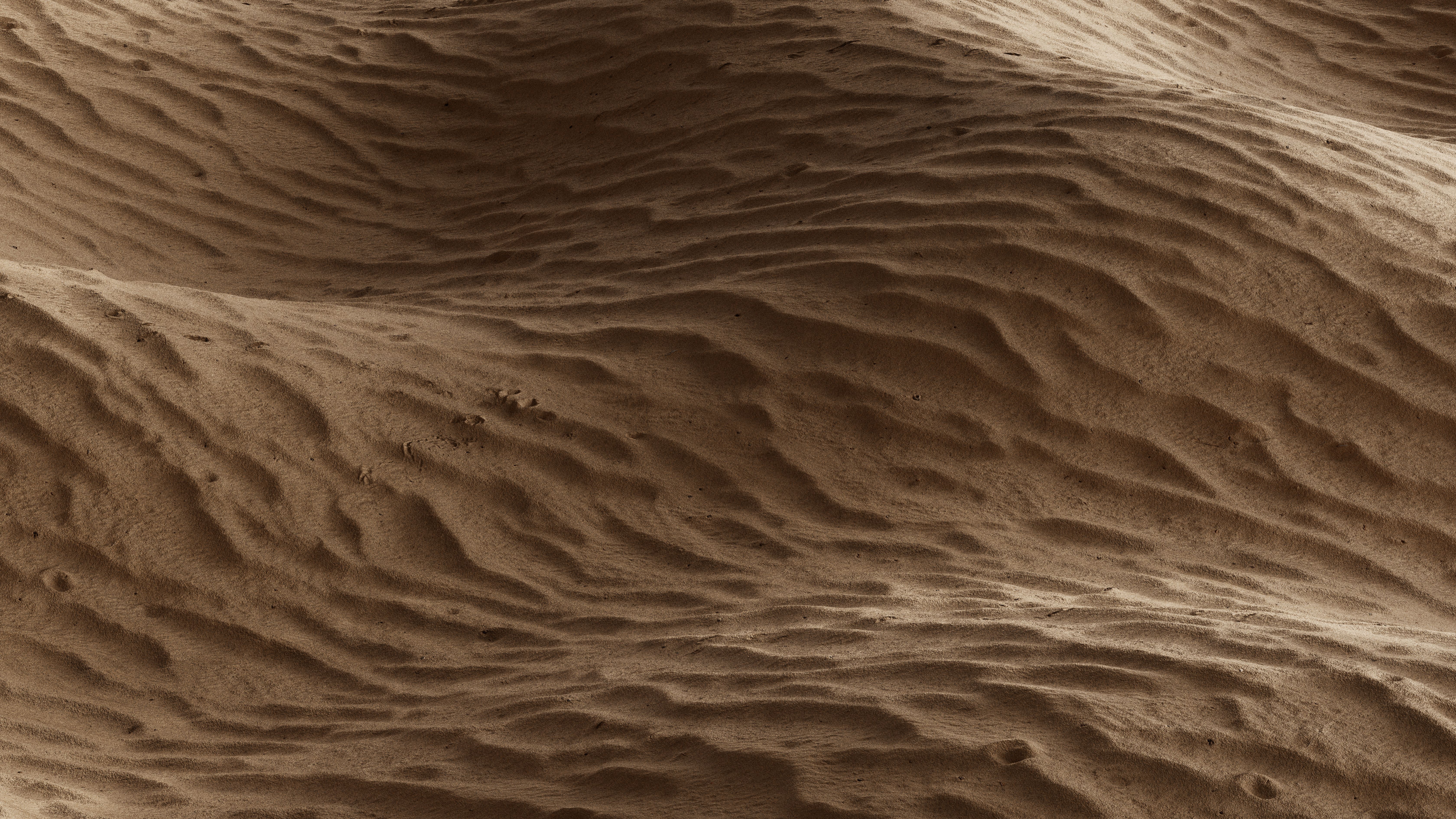 Wind sculpted sand dunes in golden hue, Togo