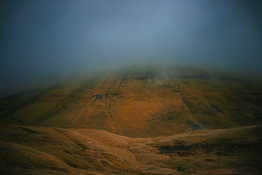Serene misty morning over the green hills of Sligo, Ireland, shrouded in atmospheric fog.