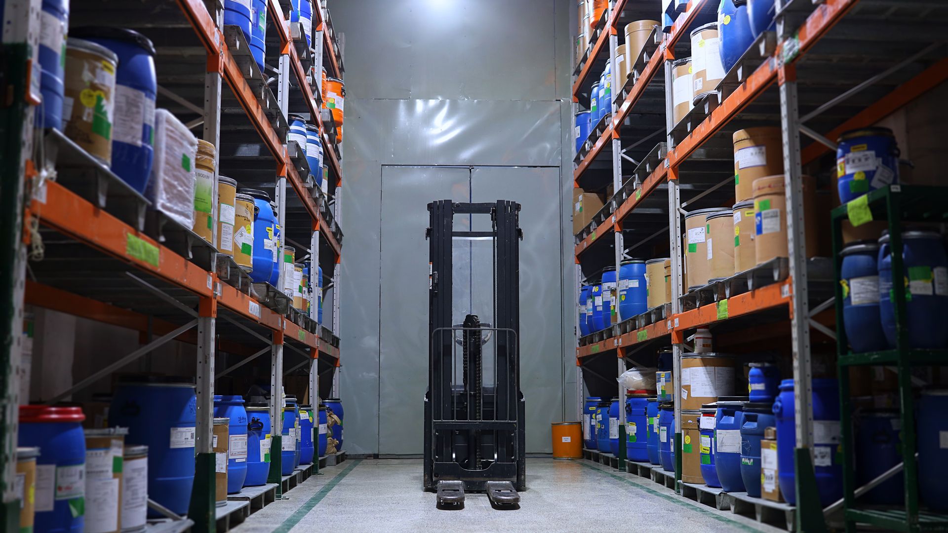 Modafinil Customs Regulations: Understanding the Legal Landscape A well-organized pharmaceutical warehouse with shelves and a forklift in Islamabad, Pakistan — modafinil customs regulations