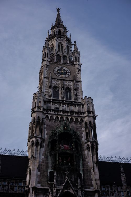 Free The iconic Neue Rathaus Glockenspiel in Munich under a vivid blue sky. Stock Photo