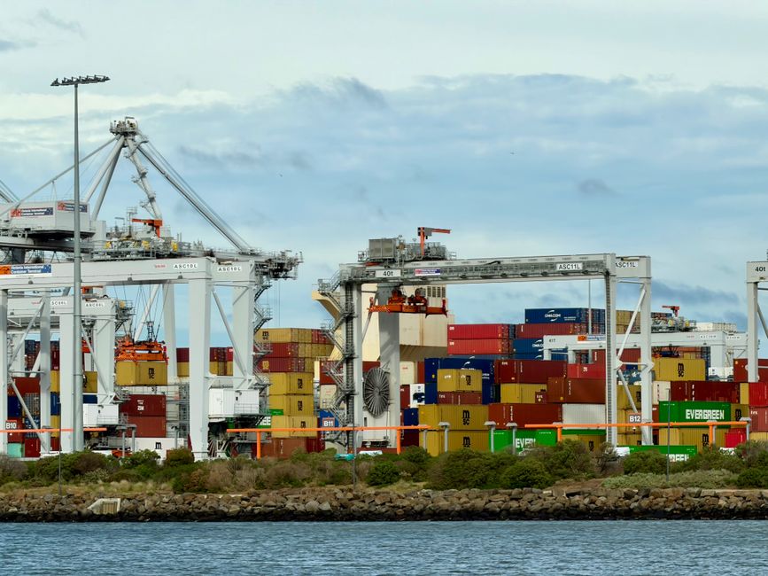 Colorful shipping containers stacked at Port Melbourne terminal in Victoria, Australia. Colorful shipping containers stacked at Port Melbourne terminal in Victoria, Australia.