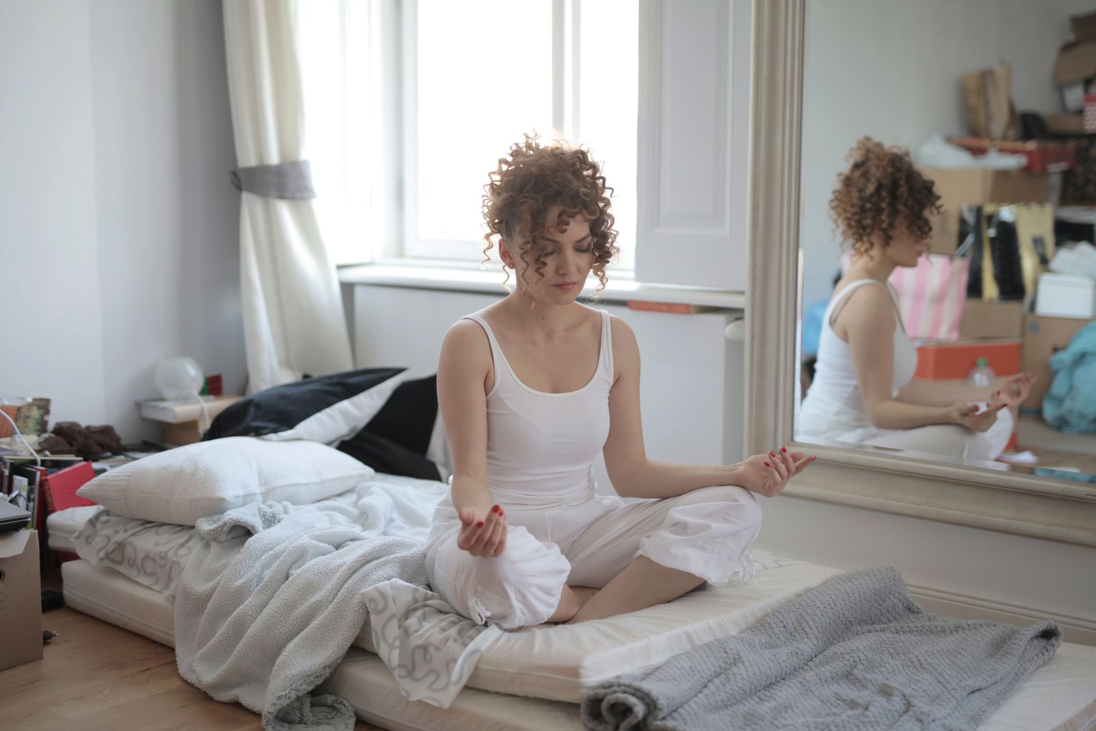 Person meditating in lotus pose