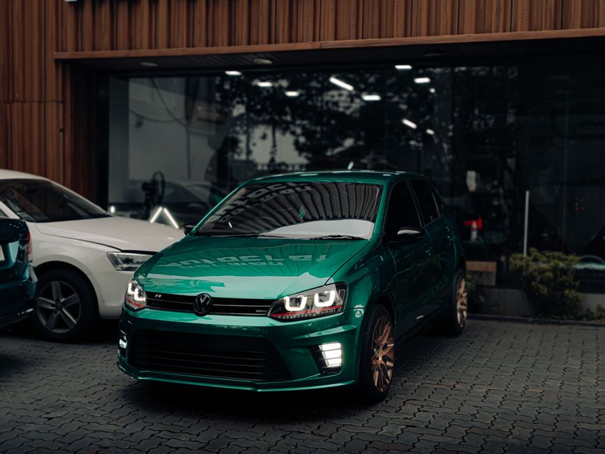 A customer comparing Volkswagen trim levels at a local dealership.