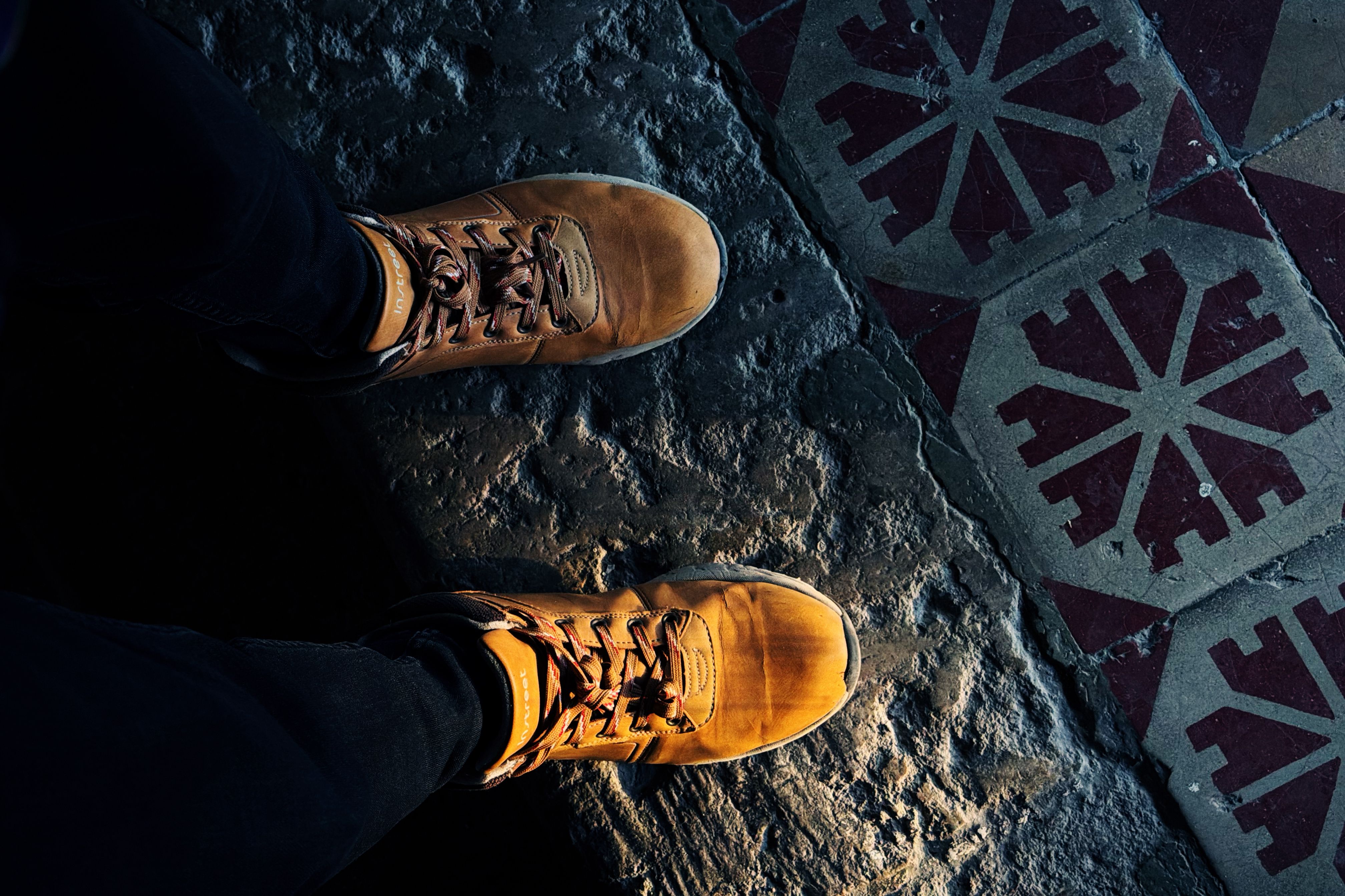 macro shot of a dirty shoe sole on a tiled floor