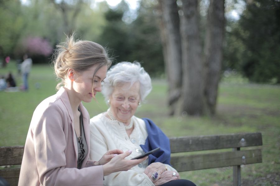 Caregiver gently helping a senior with grooming at home