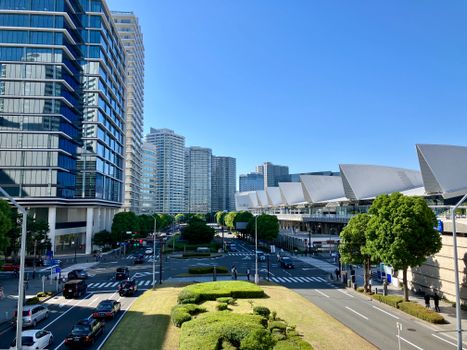 Vibrant cityscape of Yokohama, Japan, showcasing modern architecture and clear blue skies.