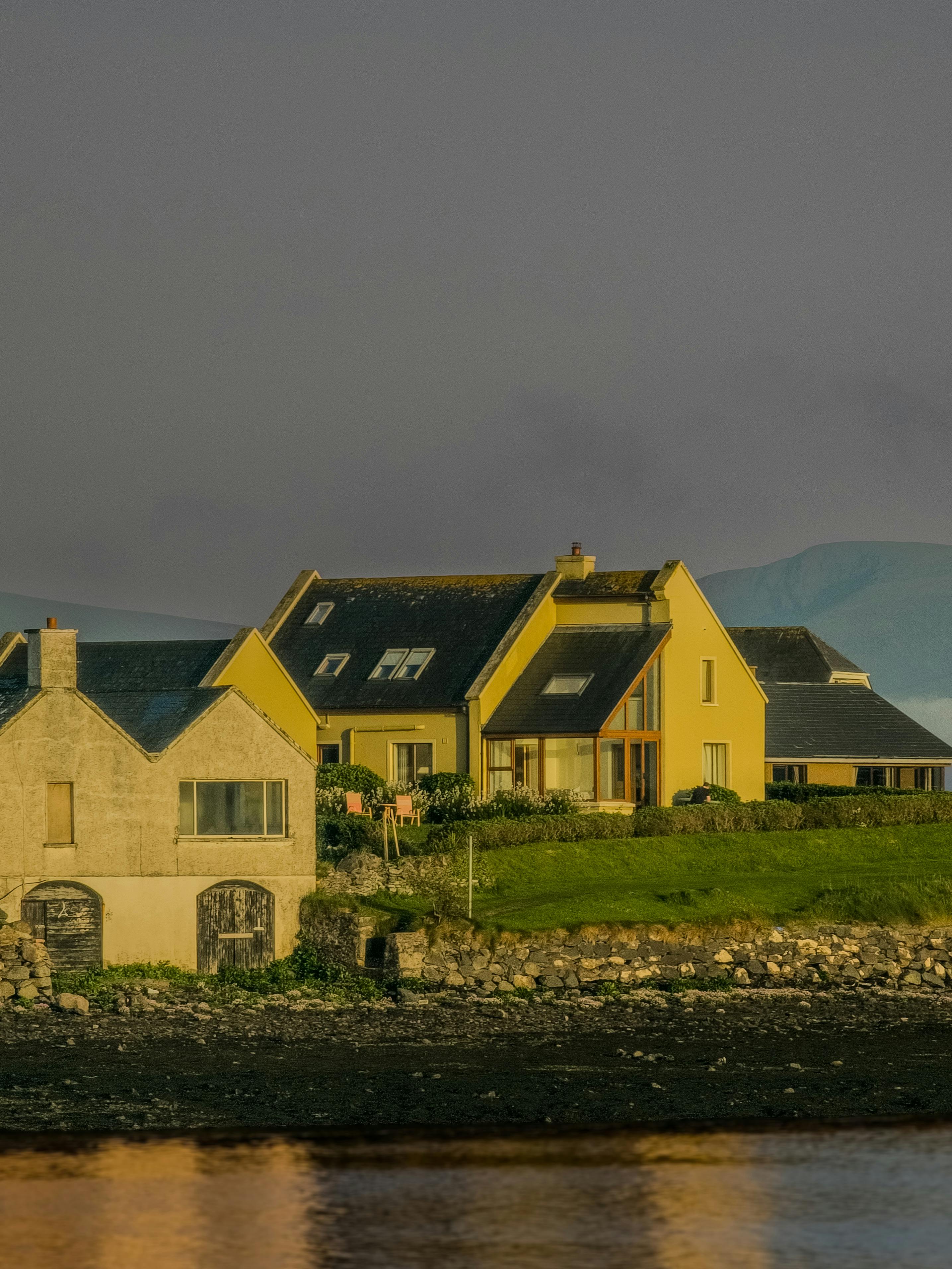 Picturesque view of coastal houses in Dingle, Ireland, during the day.