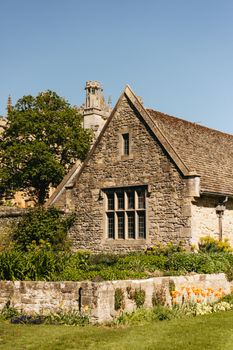 A picturesque stone building with classic architecture in Oxford, UK, on a sunny day.