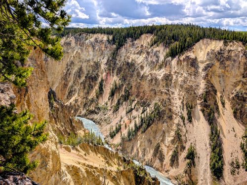 Free Breathtaking view of the Grand Canyon of the Yellowstone with vibrant cliffs and lush pines in Yellowstone National Park. Stock Photo