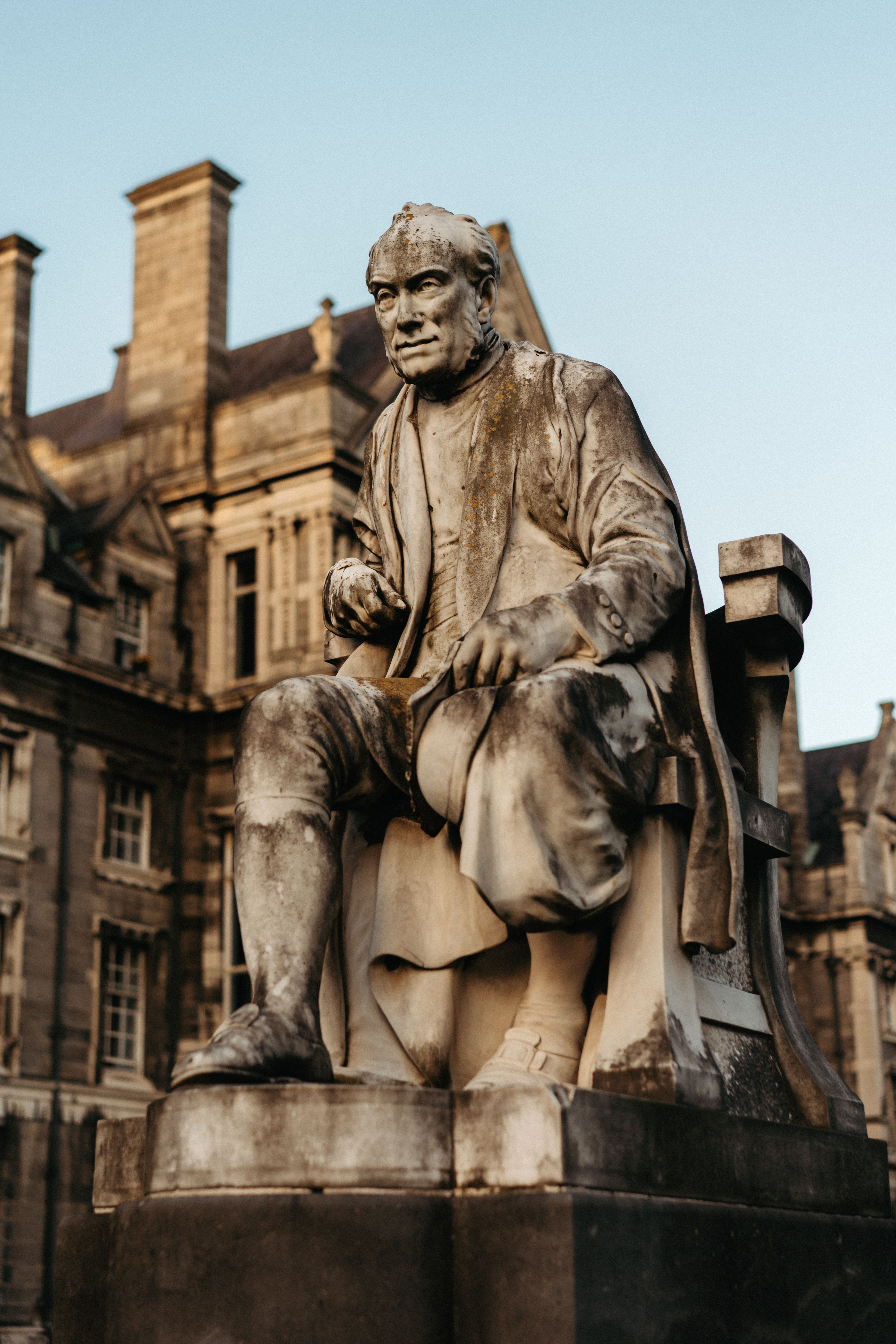 Close-up of a historic statue at Trinity College in Dublin, Ireland.