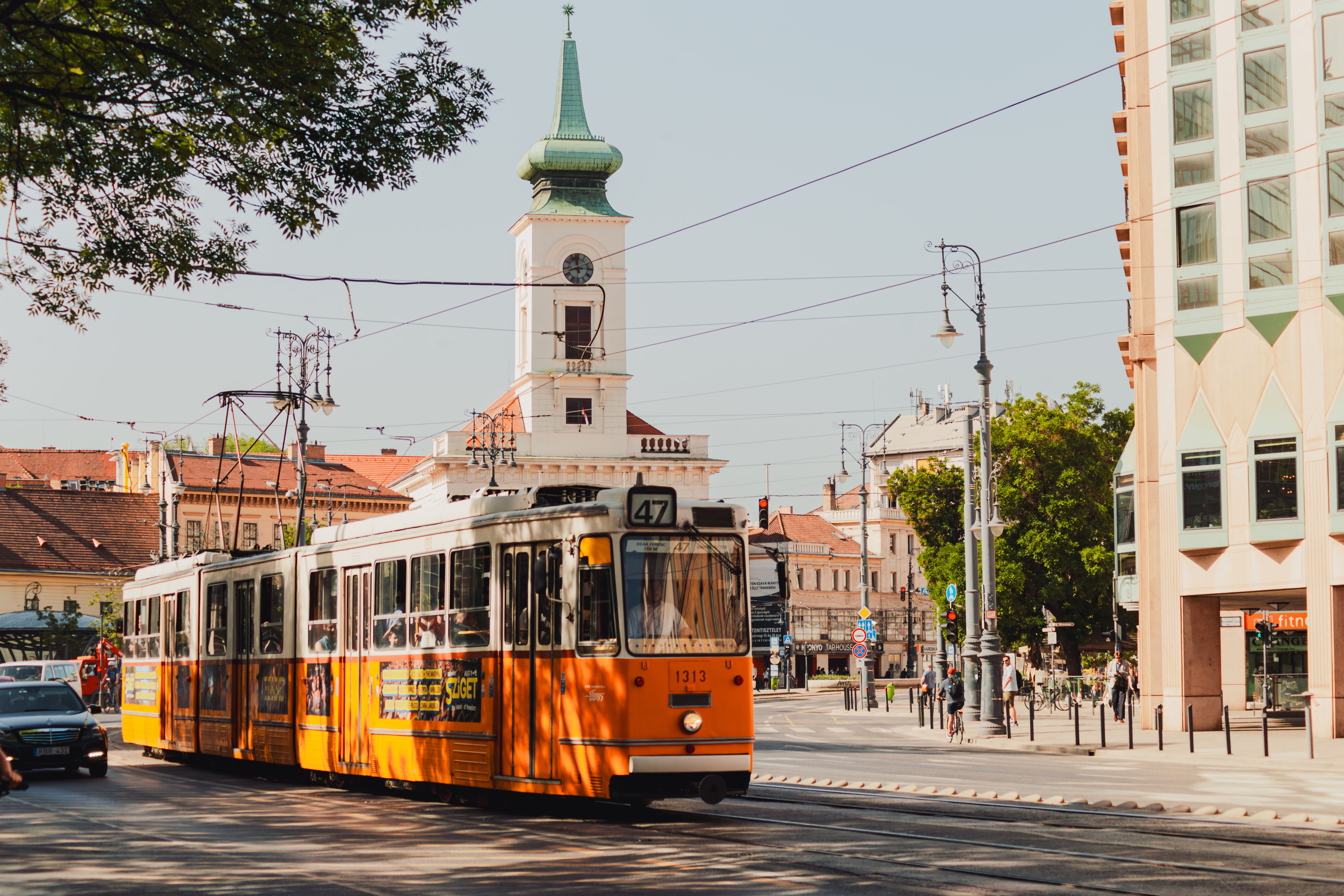 Yellow tram moving through a street in Budapest, Hungary