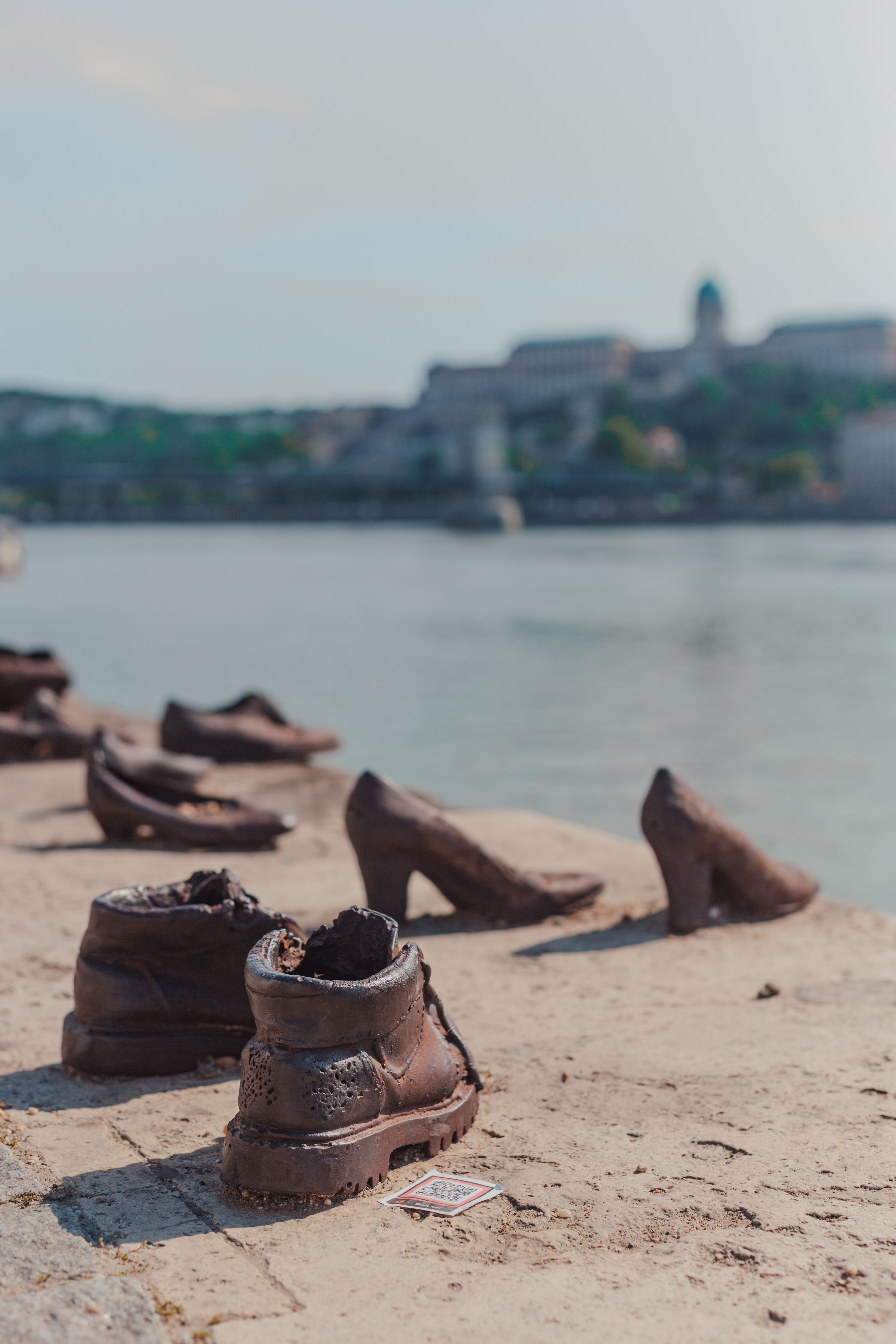Solemn memorial of shoes on the Danube Riverbank honoring Holocaust victims in Budapest, Hungary.