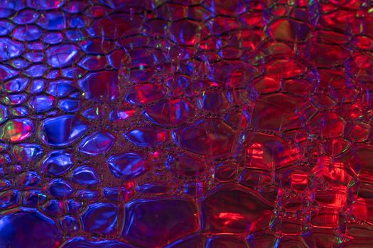 A vivid abstract bubble pattern showcasing red and blue hues, creating a modern and glossy effect.