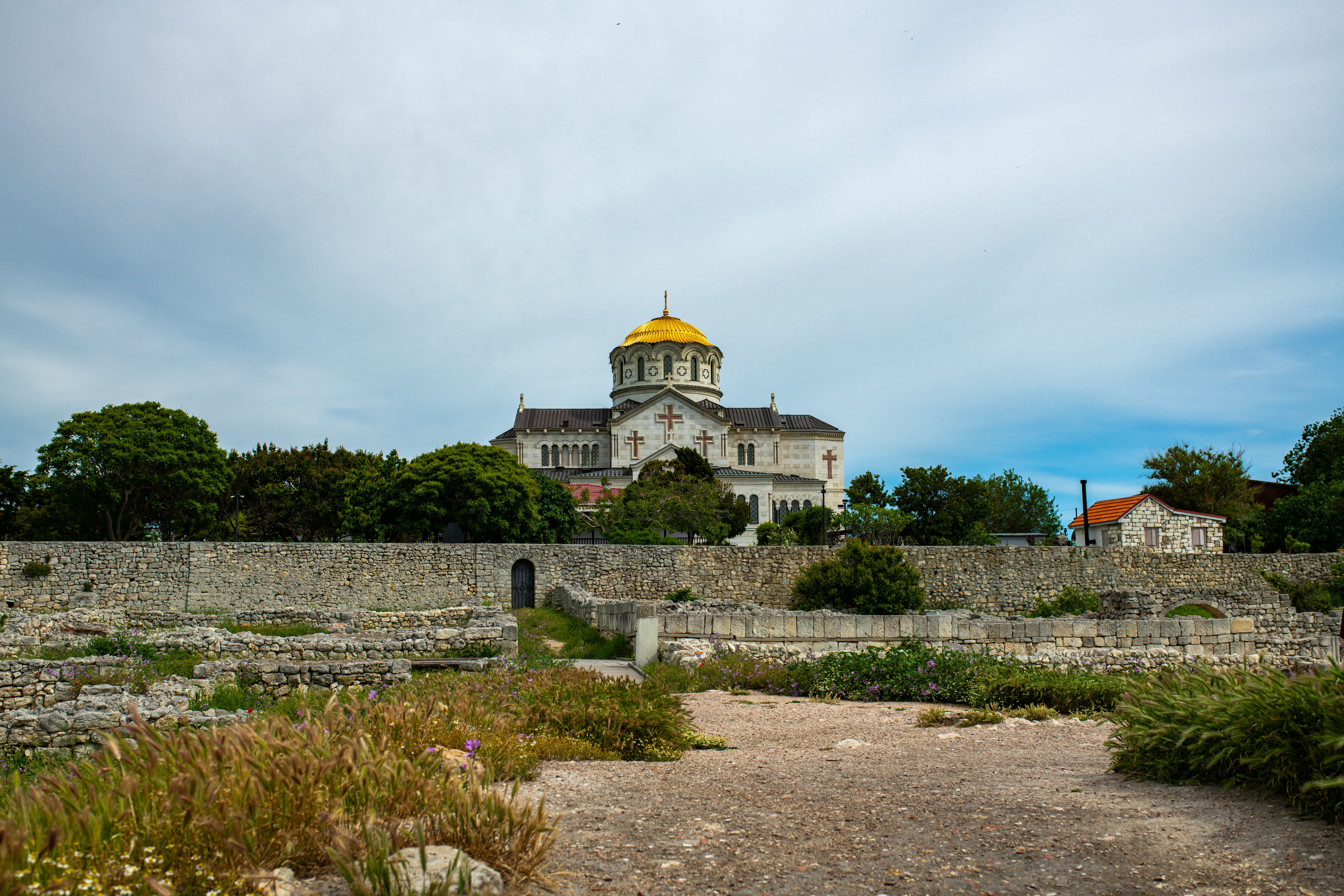 View of St. Vladimir's Cathedral in Chersonesus, Sevastopol, surrounded by ancient ruins.