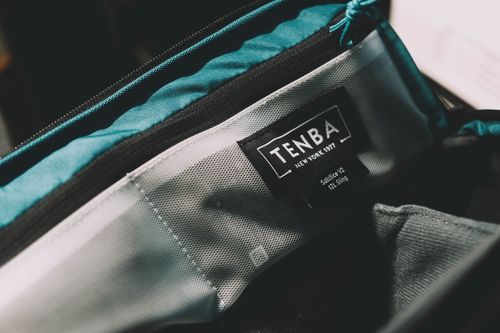 Free Detailed view of the interior of a Tenba camera bag, showing the logo and materials. Stock Photo