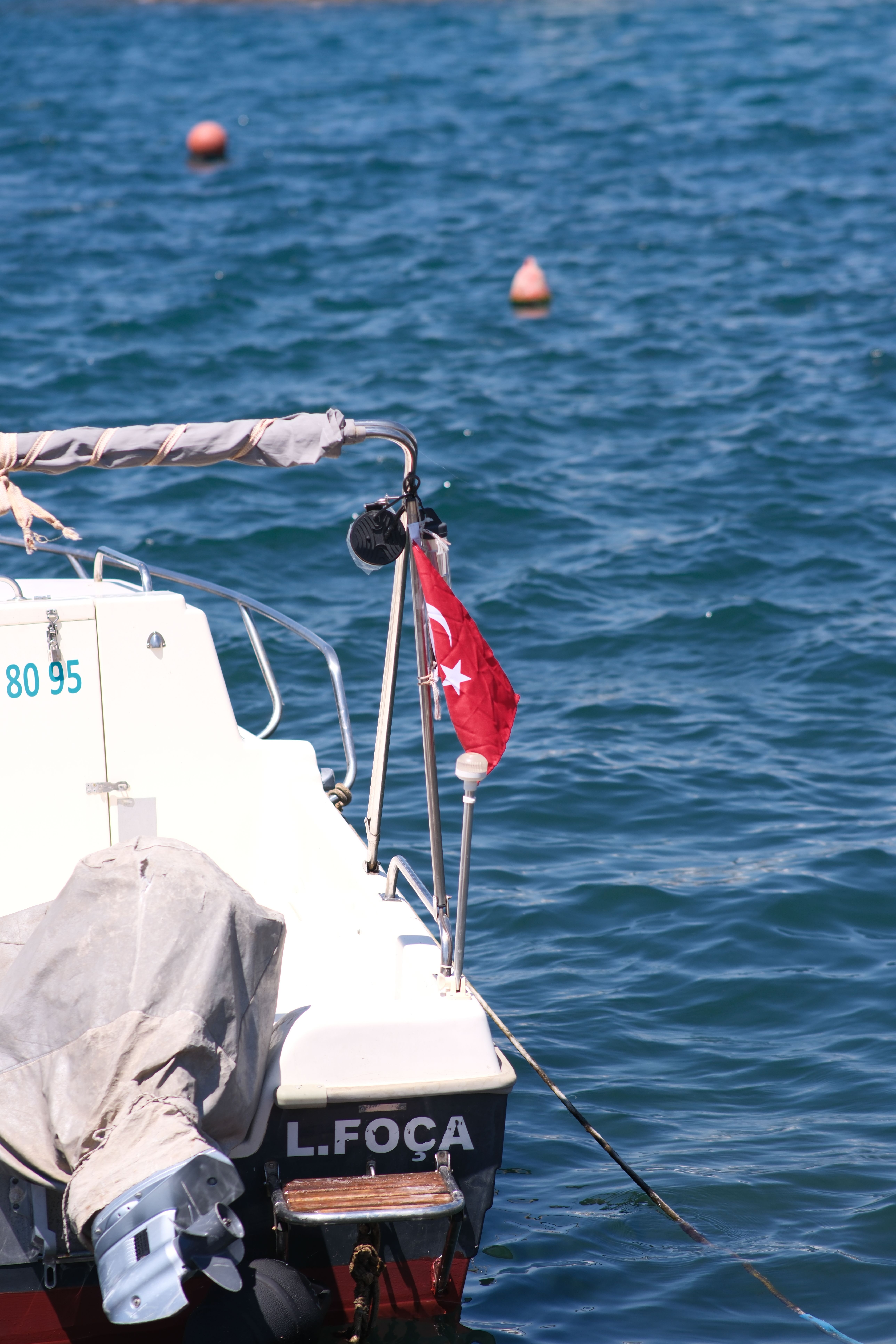 Close-up of a boat with a Turkish flag on the sea in Foça, İzmir.