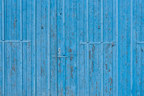 Free Close-up of weathered blue painted wooden door with rustic, peeling texture. Stock Photo