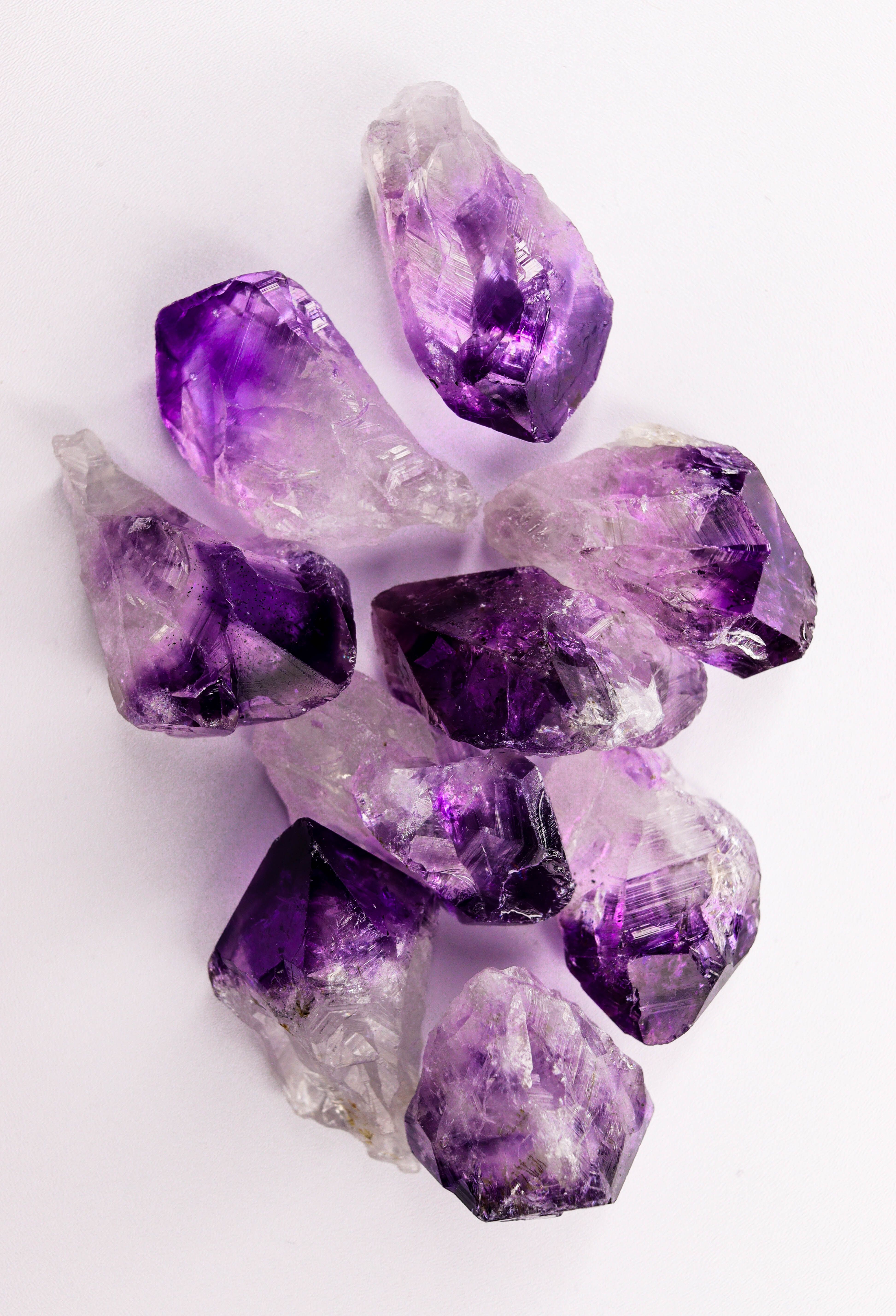 Cluster of natural amethyst geodes displaying vibrant purple hues.