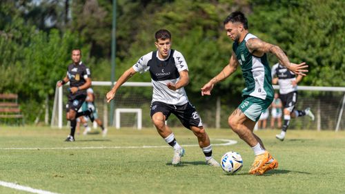 Free Two soccer players in action on a sunny day, showcasing athleticism on the field. Stock Photo